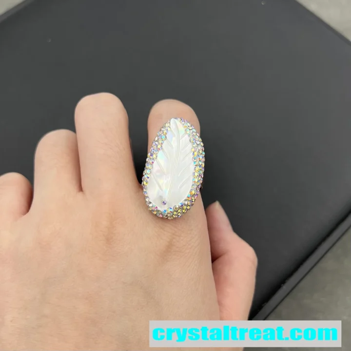 Carved Mother of Pearl Feather Ring with Crystal Halo product image 1