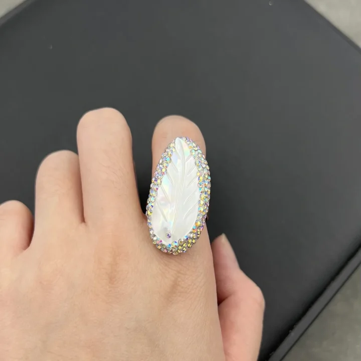 Carved Mother of Pearl Feather Ring with Crystal Halo product image 1